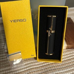 Beautiful black and gold travel perfume container